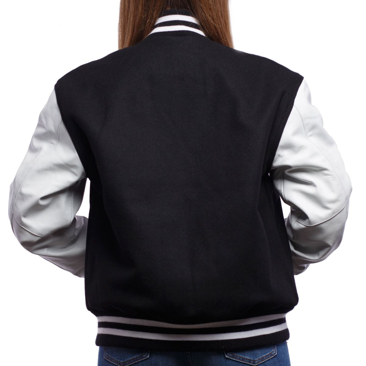 A person wearing a Black Wool Body & Bright White Leather Sleeves Letterman Jacket.